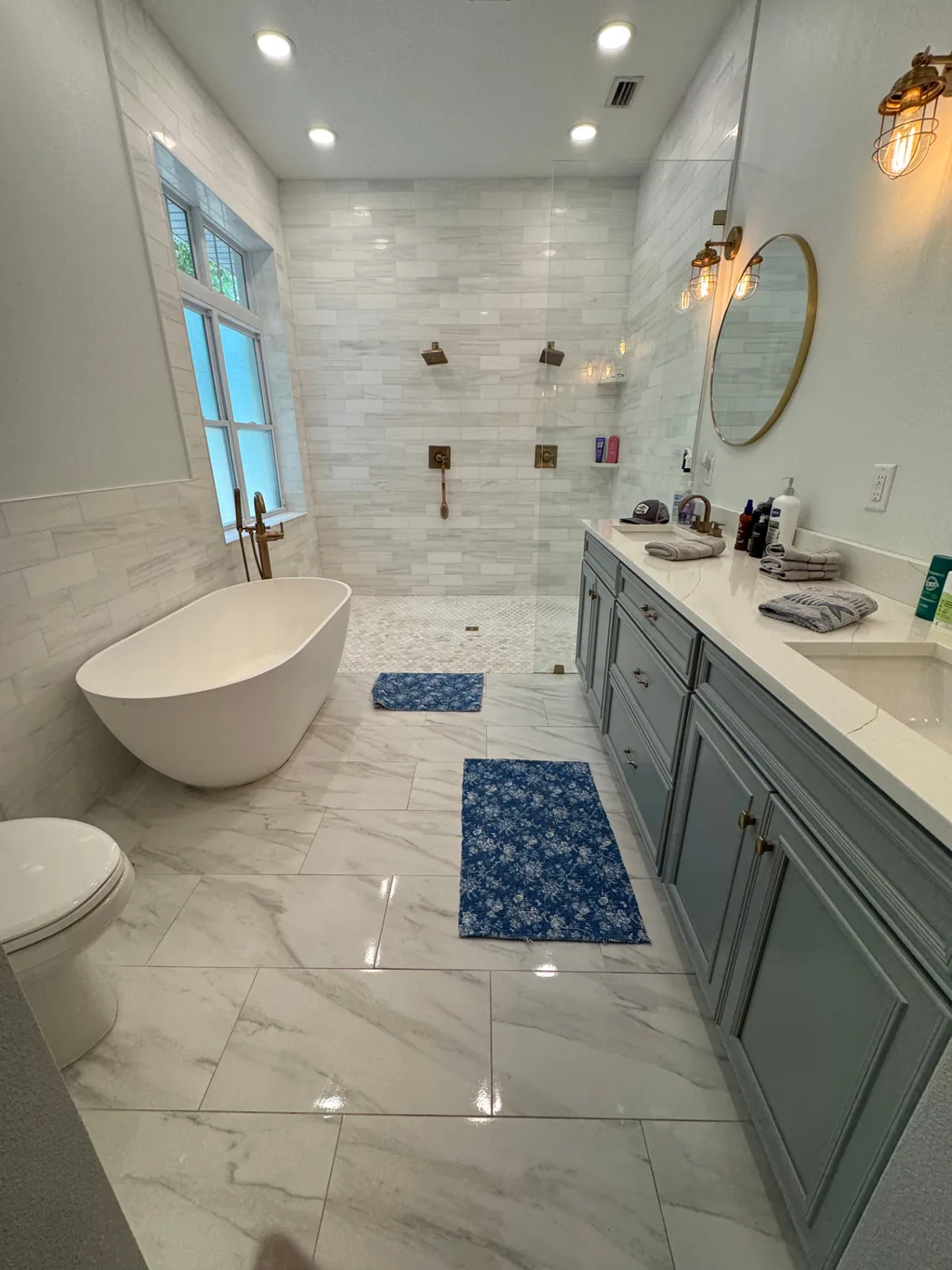 Spotless luxury bathroom with freestanding tub and marble tile after a professional cleaning